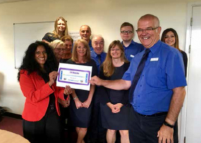 Livewell Southwest Team holding up acheivement for Wellbeing