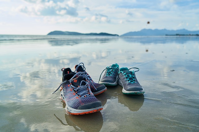 Walking shoes on a beach background