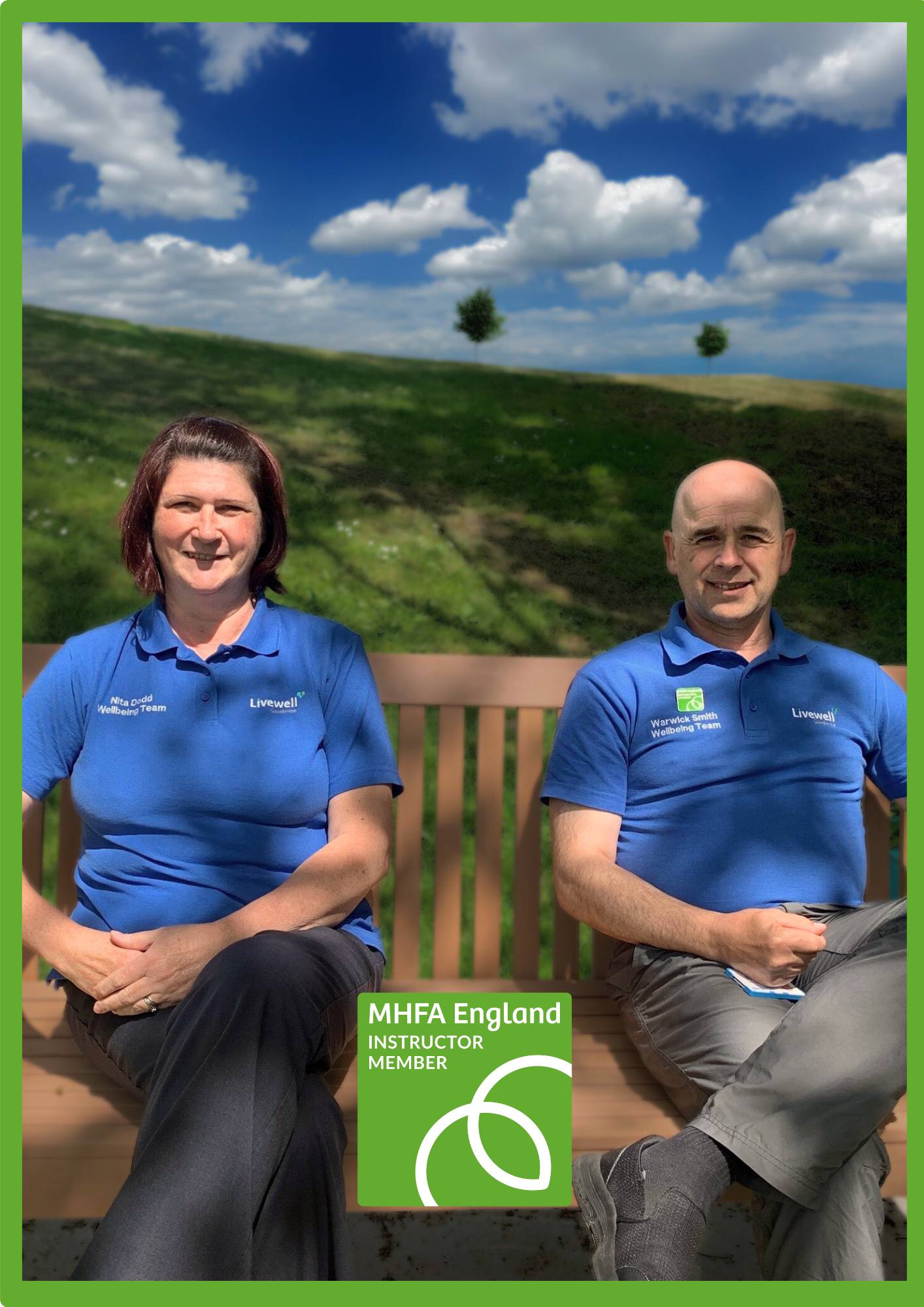 Nita and Warwick sat in a park with MHFA badge inserted